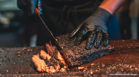 Here's Exactly How To Spritz Brisket For A Tasty Charred Crust